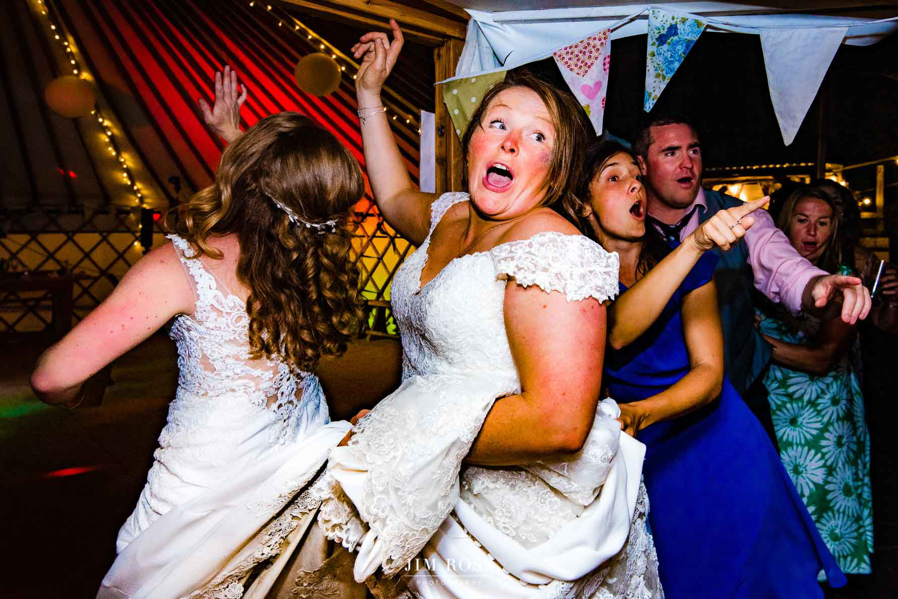 two brides leading the conga