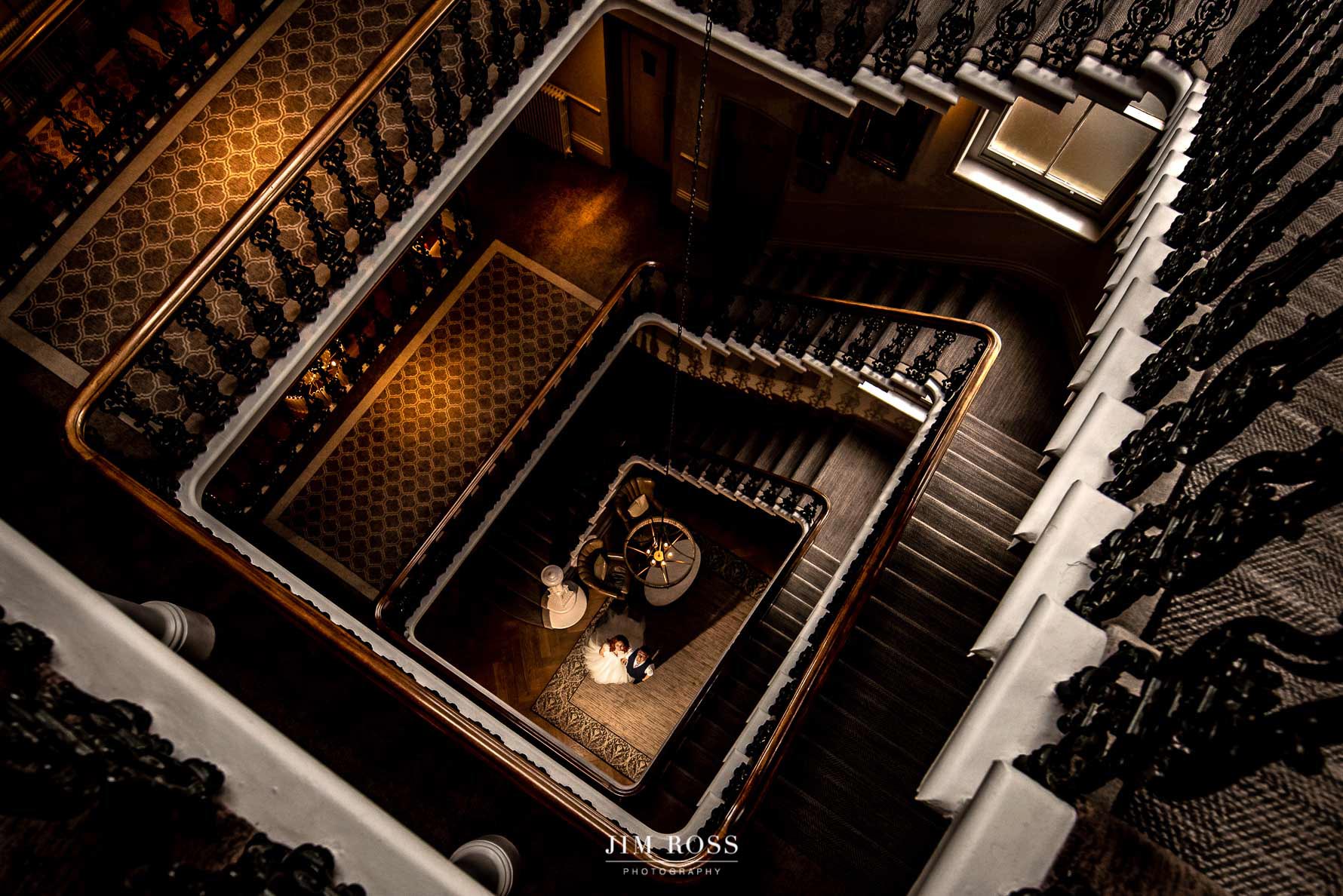 Couple at bottom of dramatic staircase at The Principal Hotel, York