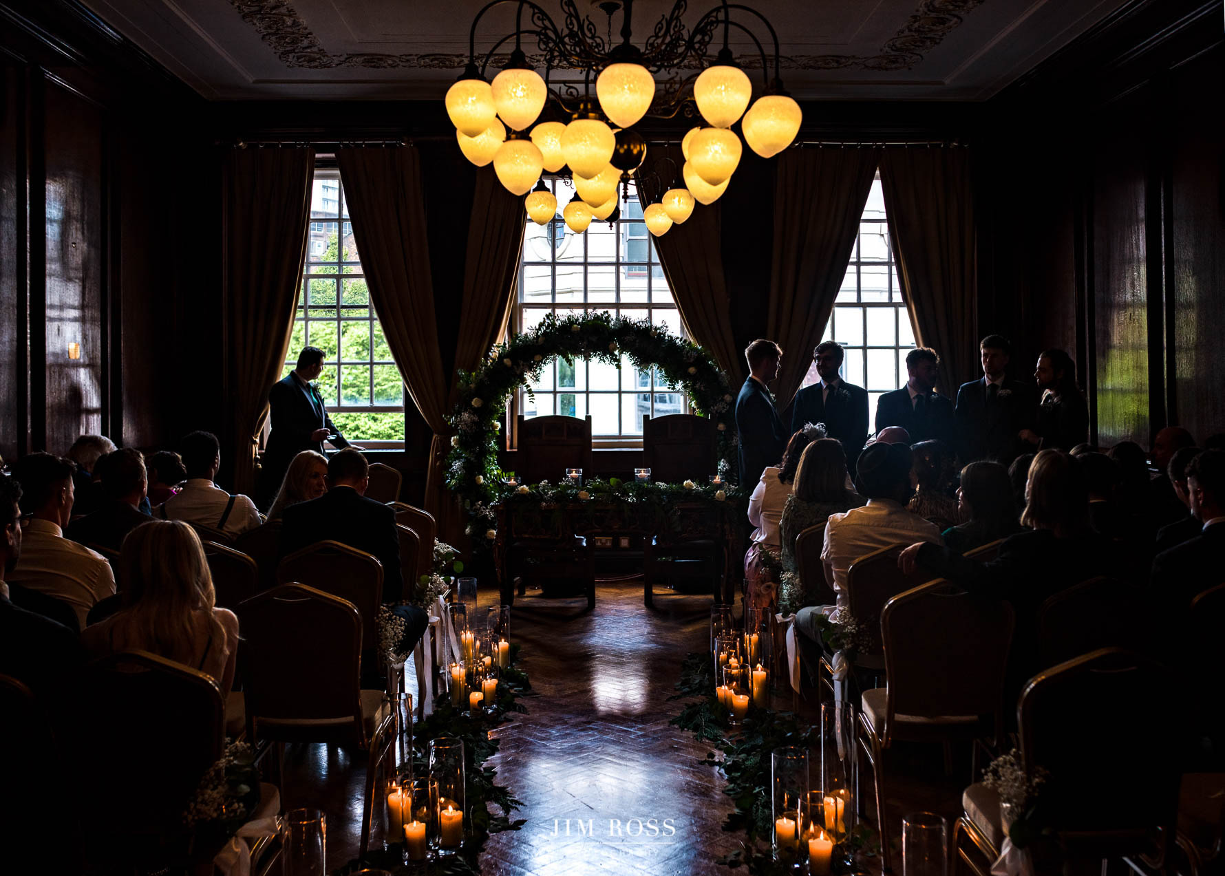 silhouette of groom waiting for bride in ceremony room