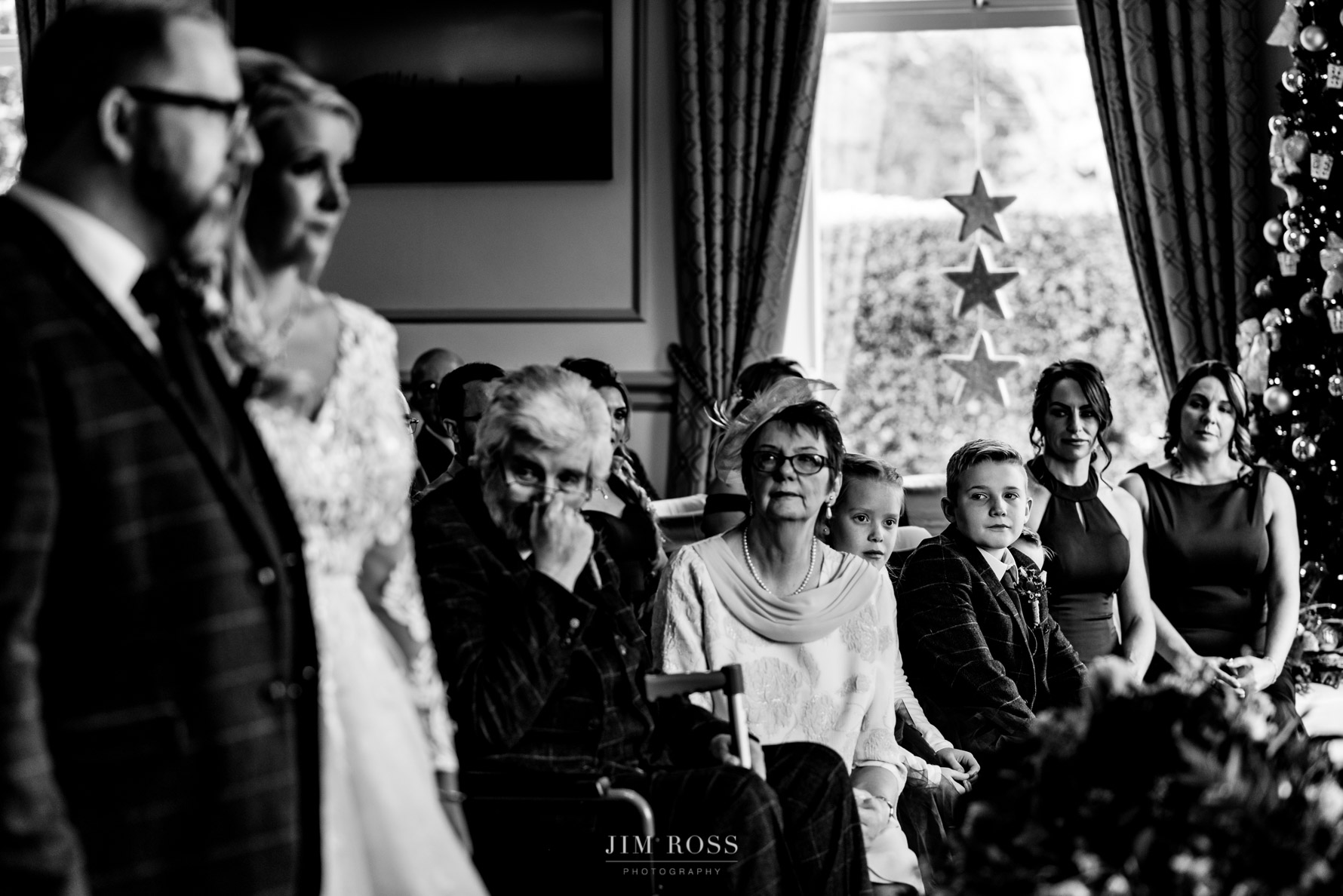 bride's family look on during ceremony