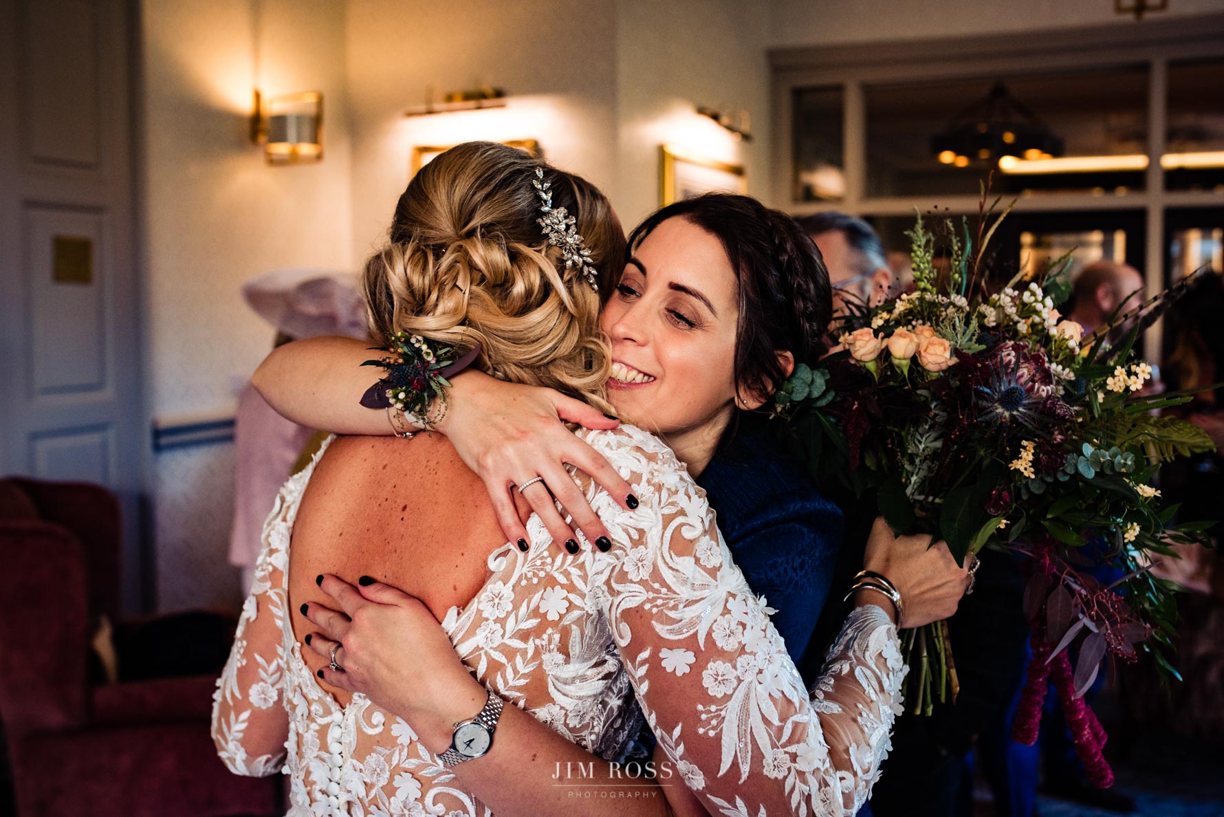 congratulatory hug from wedding guest
