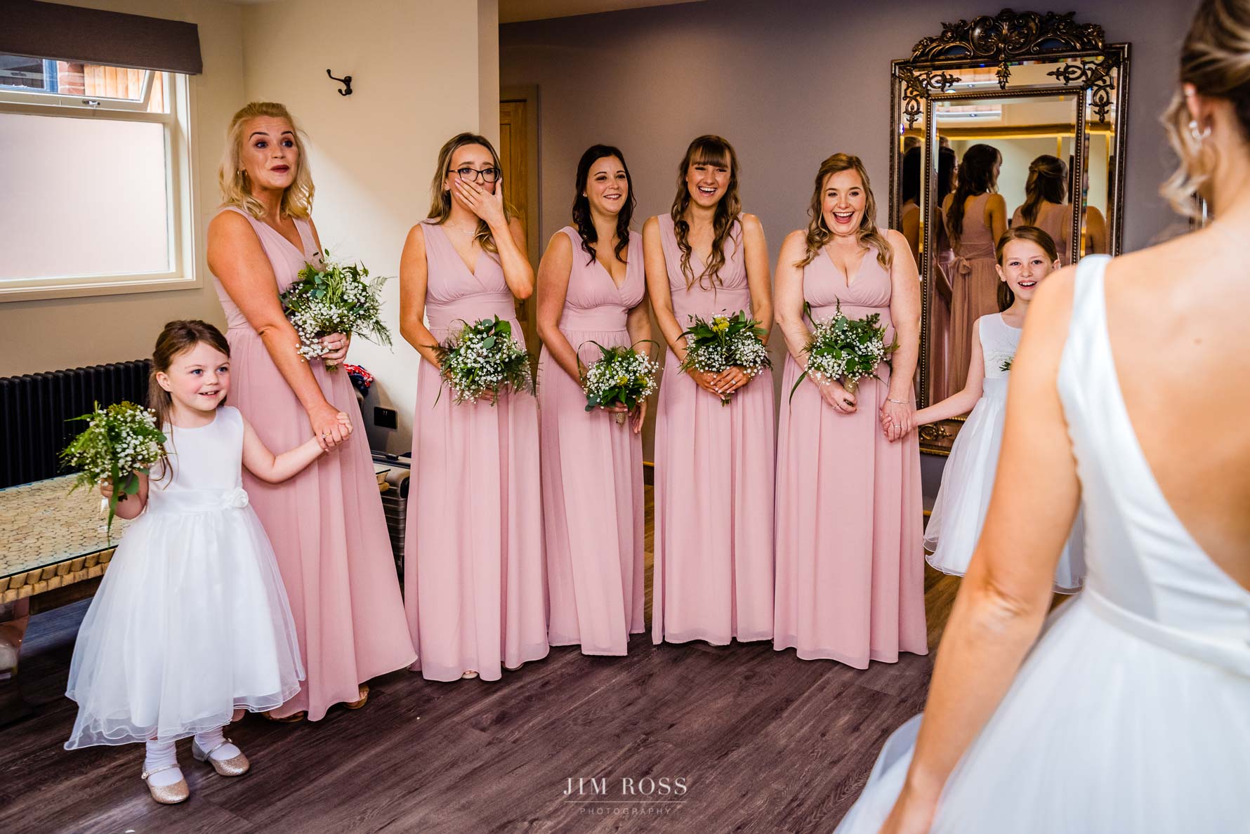 bridesmaids approving reaction to first look