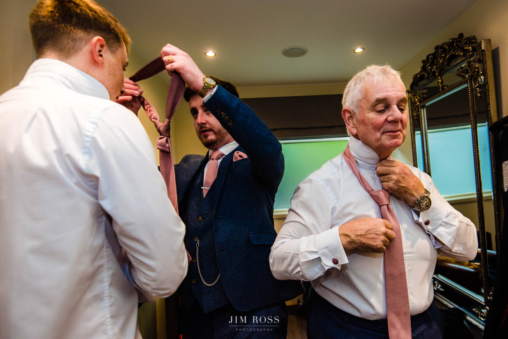 groomsmen sorting out their ties