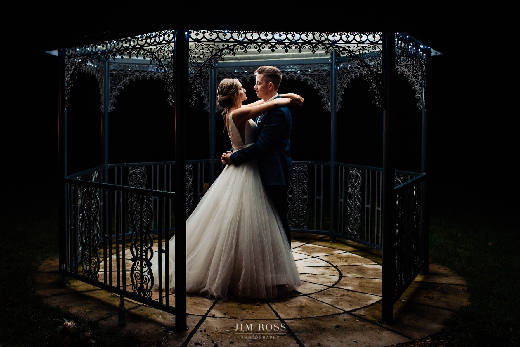 newlywed night portrait in bandstand