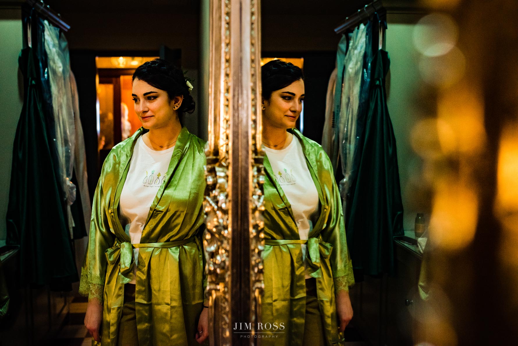 green-robed bridesmaid in reflection