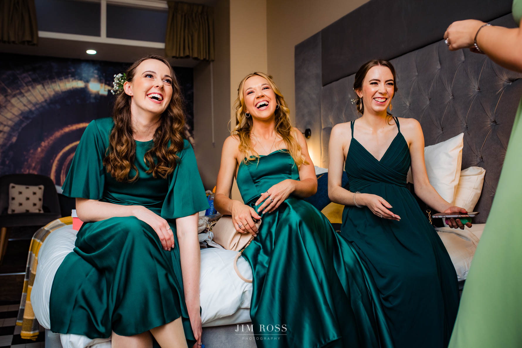bridesmaids in green enjoying a laugh
