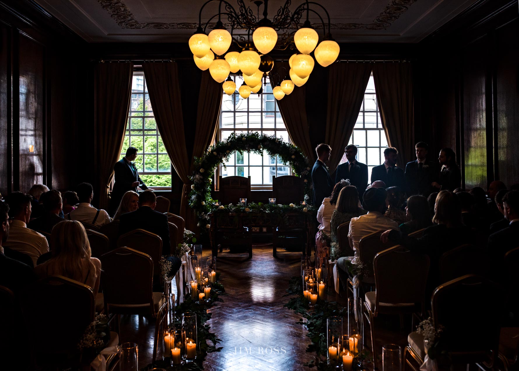 silhouette of groom having a contemplative moment in grand hall