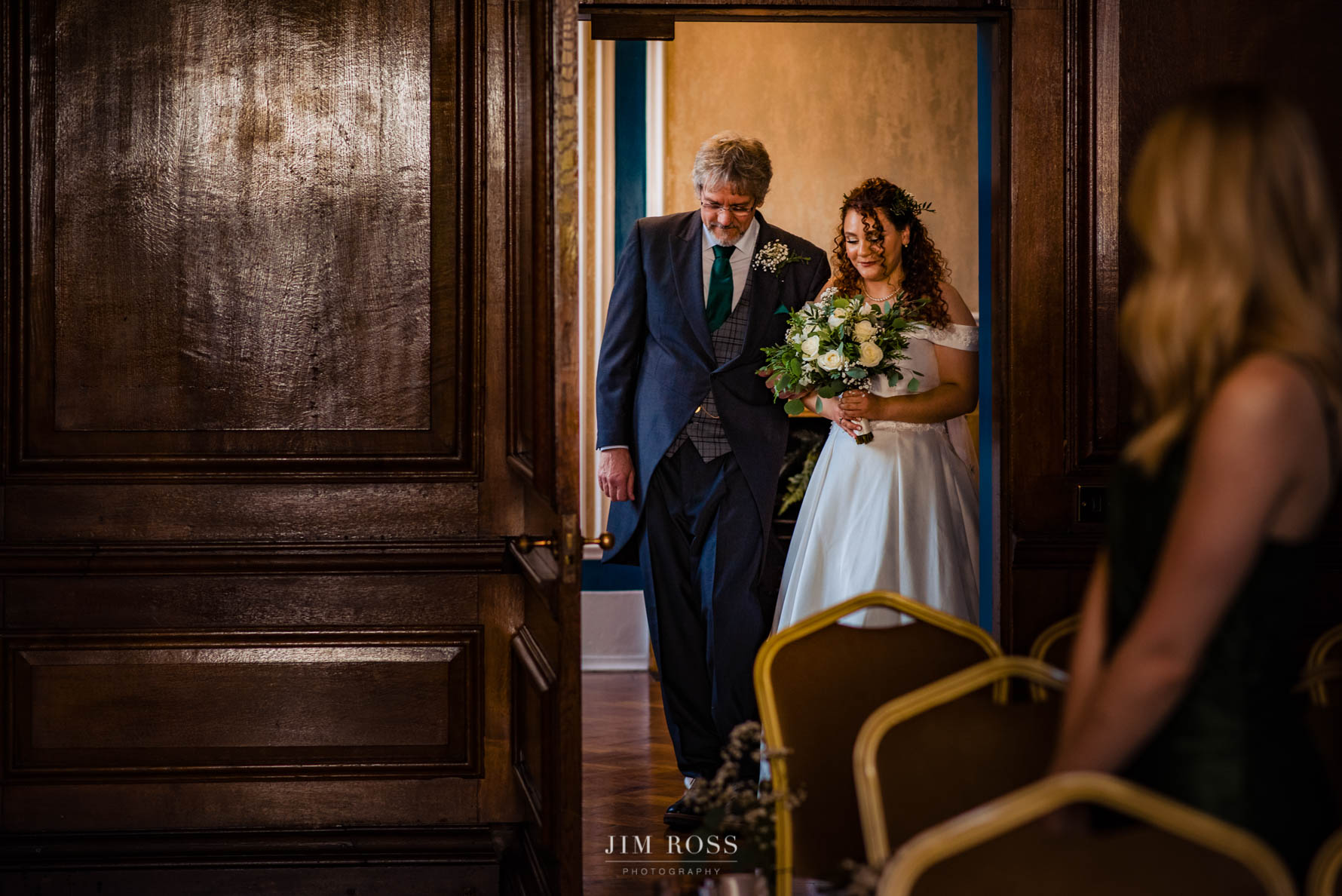 bride and father approach aisle