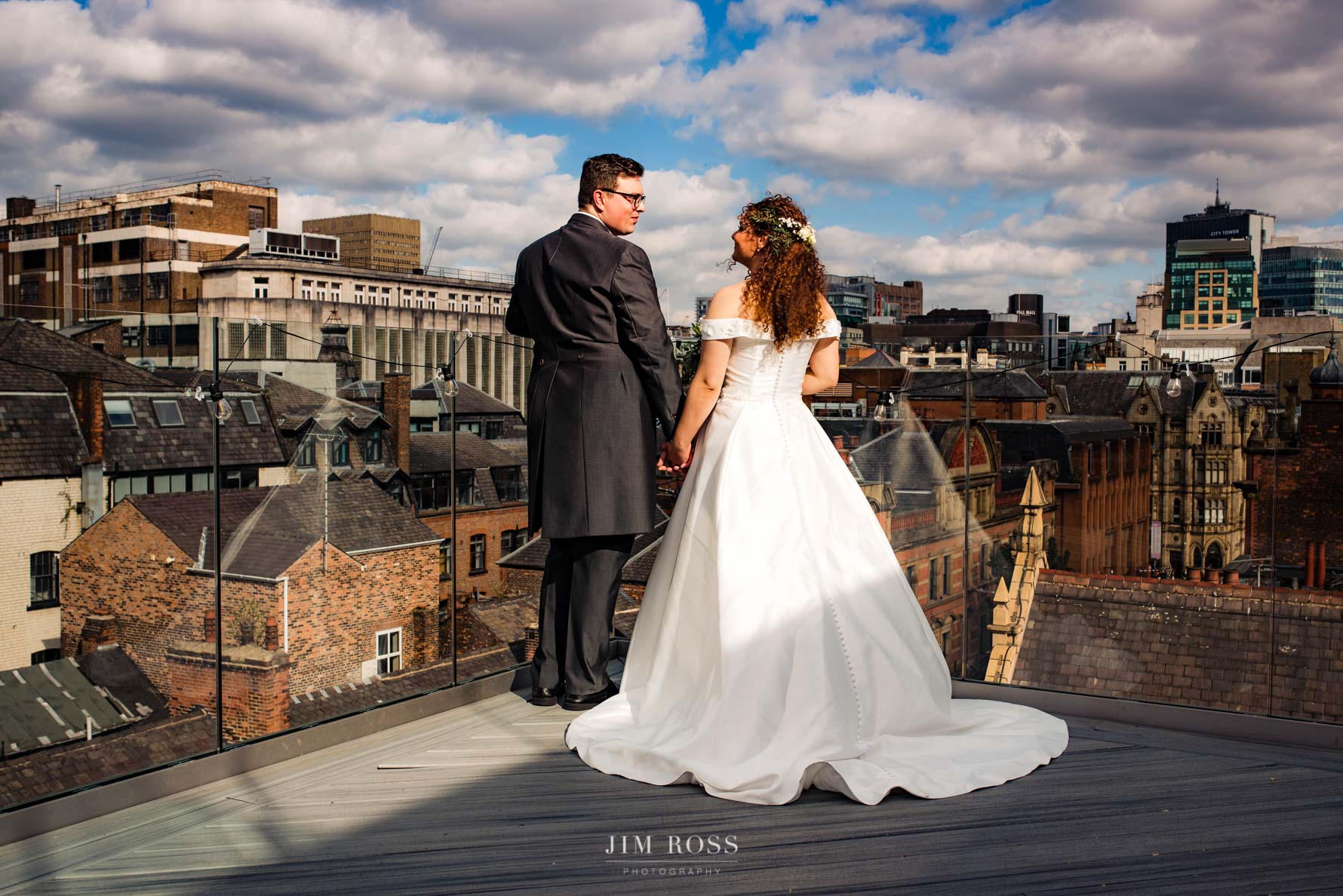 newlyweds enjoying the rooftop view