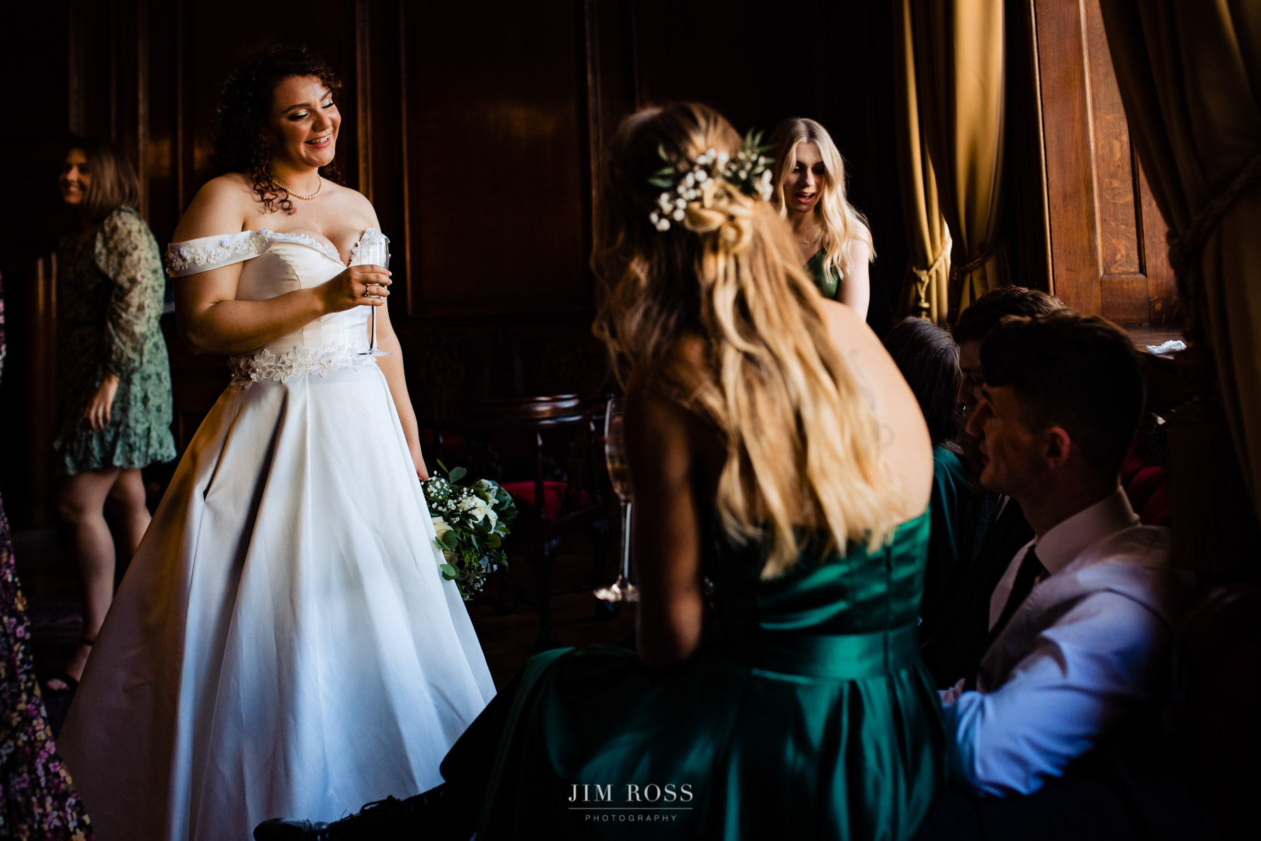 bride catching up with her guests for a giggle