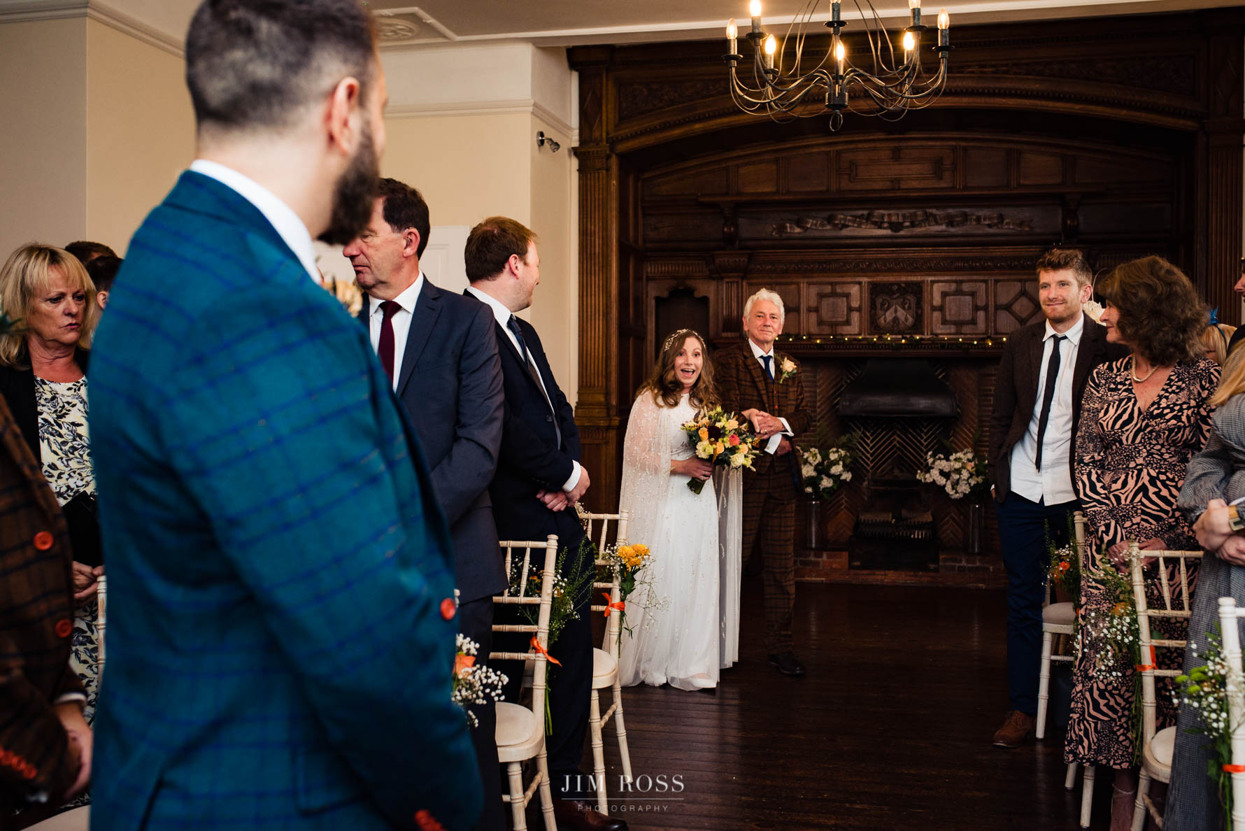 dad and excited bride enter ceremony room