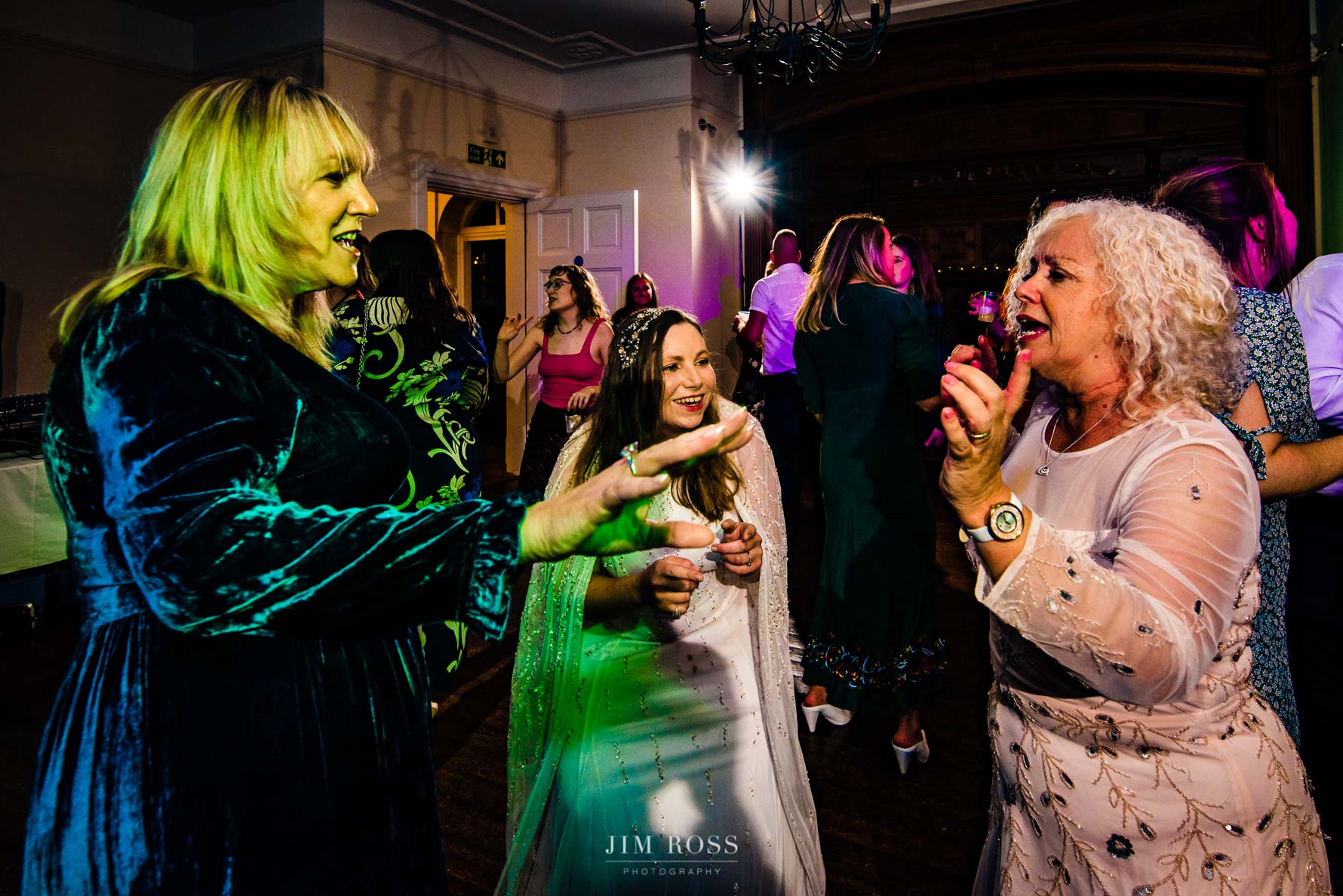 bride dancing with mums