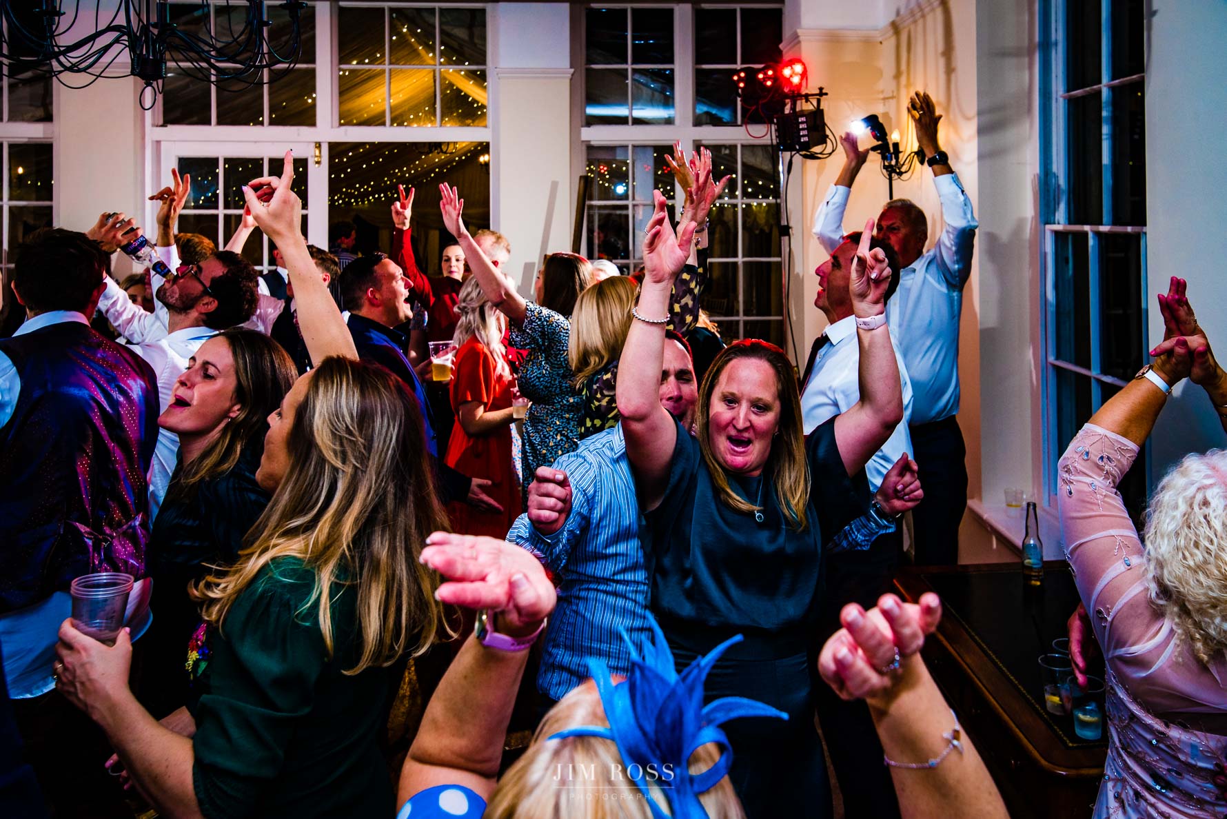 hands in the air for dancing wedding guests