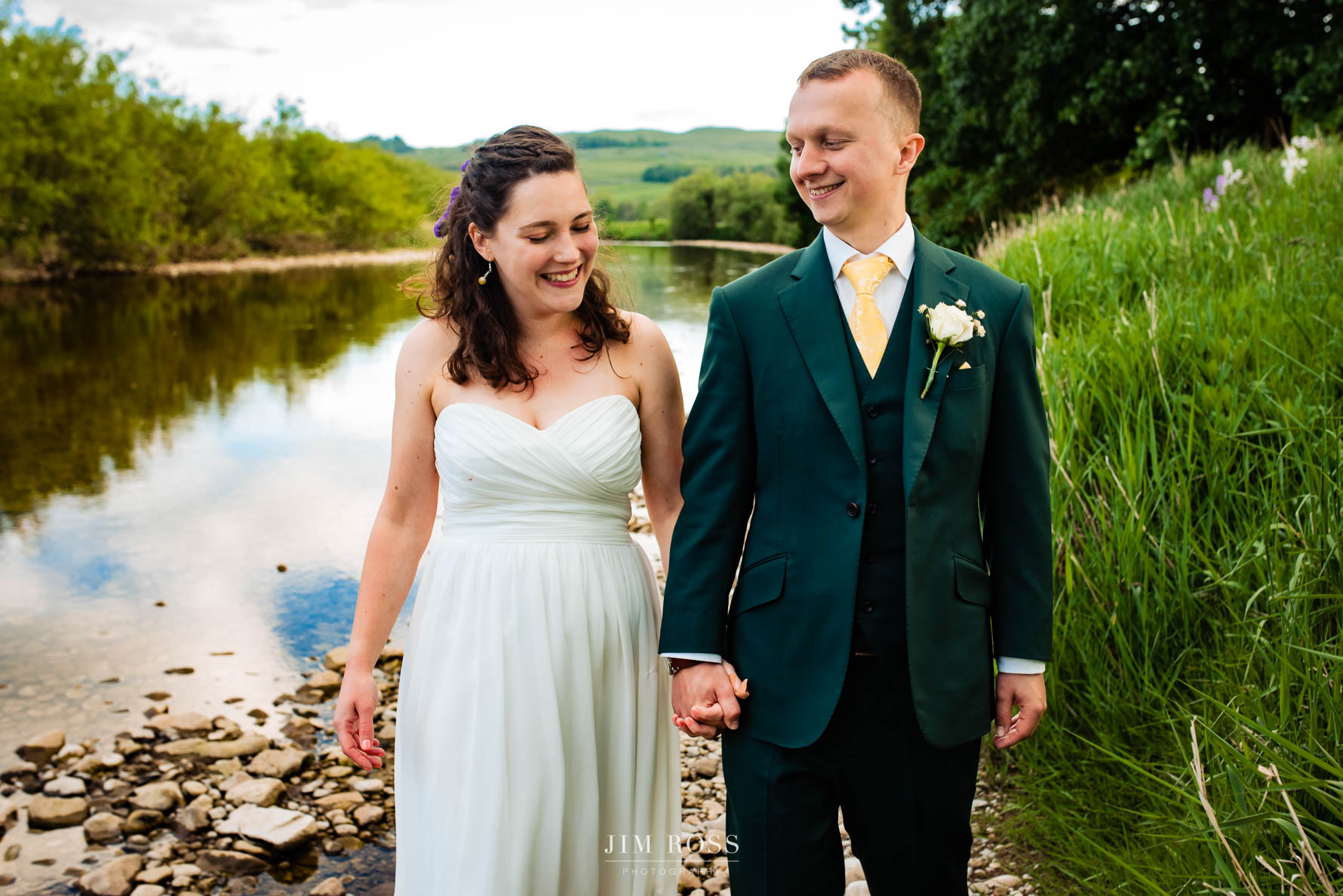 newlyweds stroll long Yorkshire river