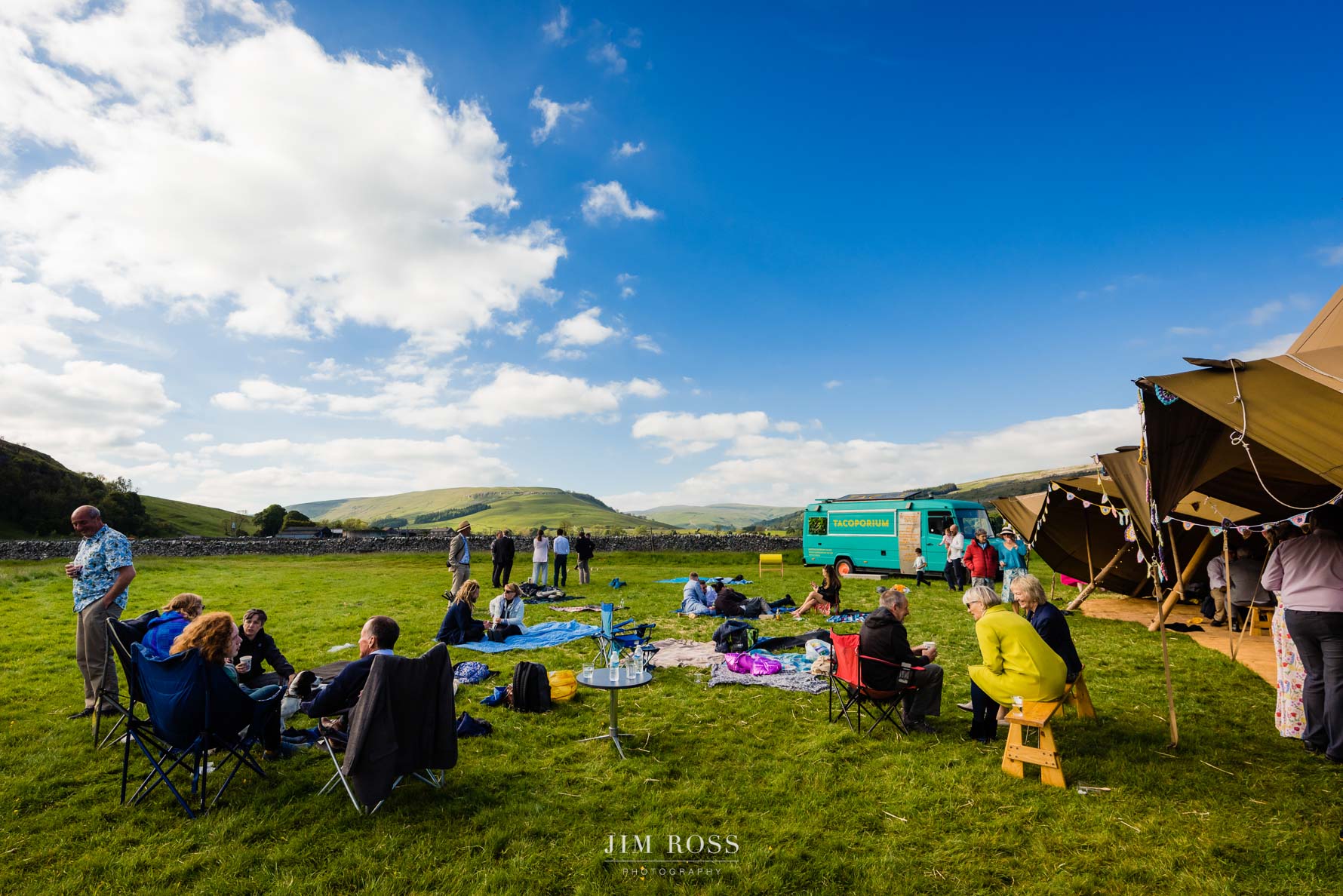 wide view of tipi wedding, taco van and yorkshire dales scenery