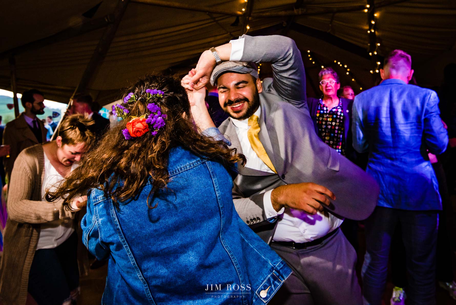 wedding guest dancing with bride