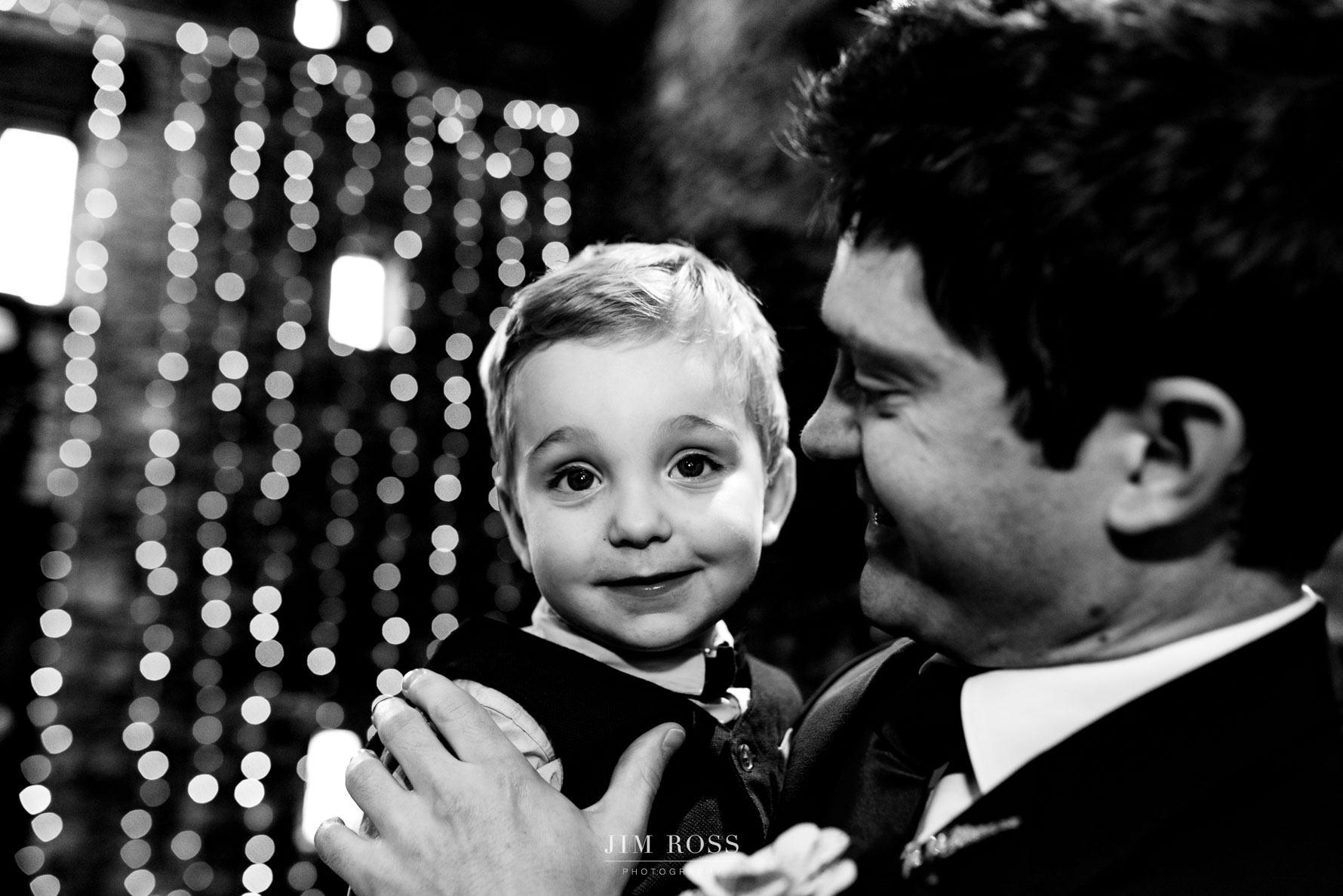 closeup of groom with cute son