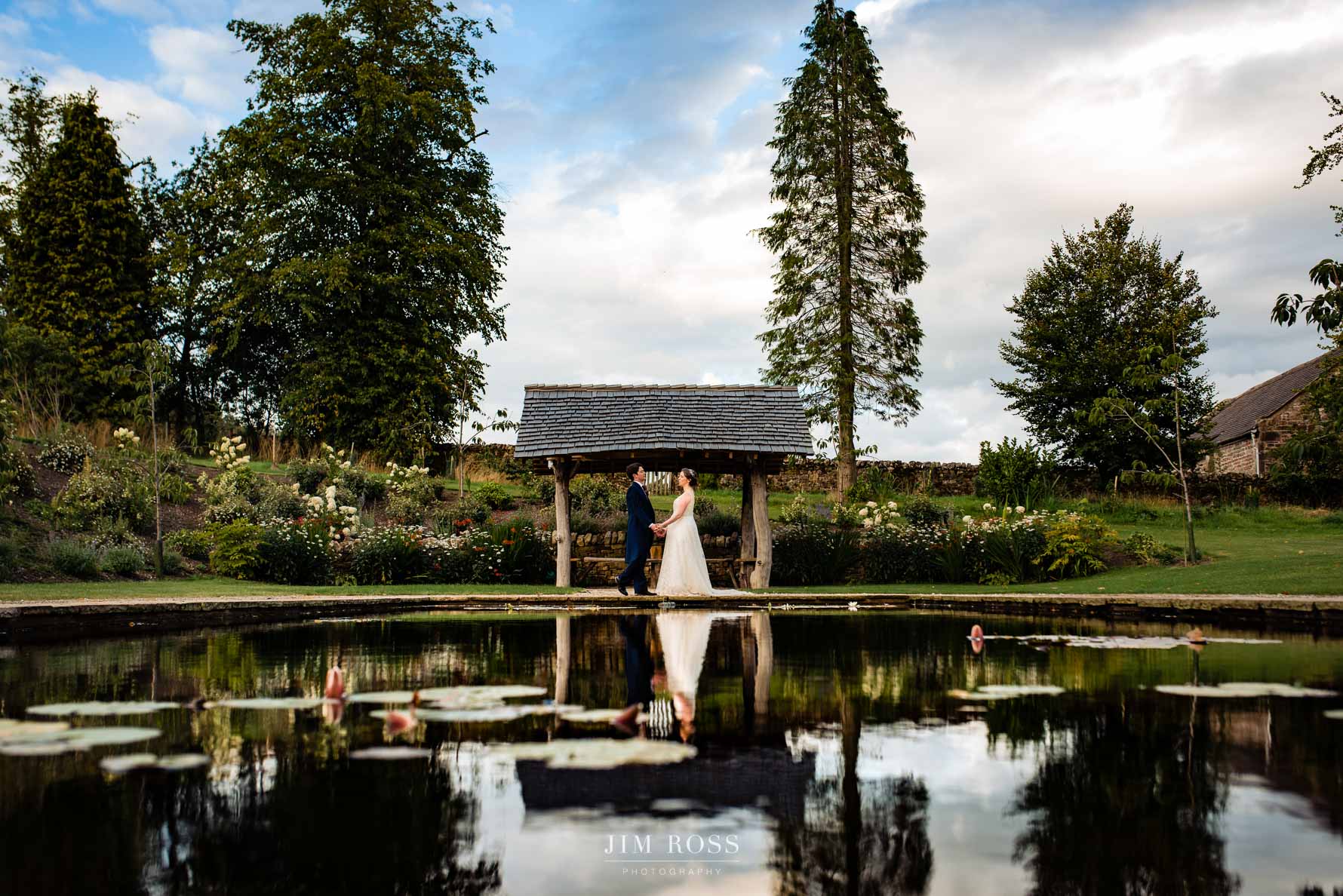 wedding portrait at Browsholme Hall pond