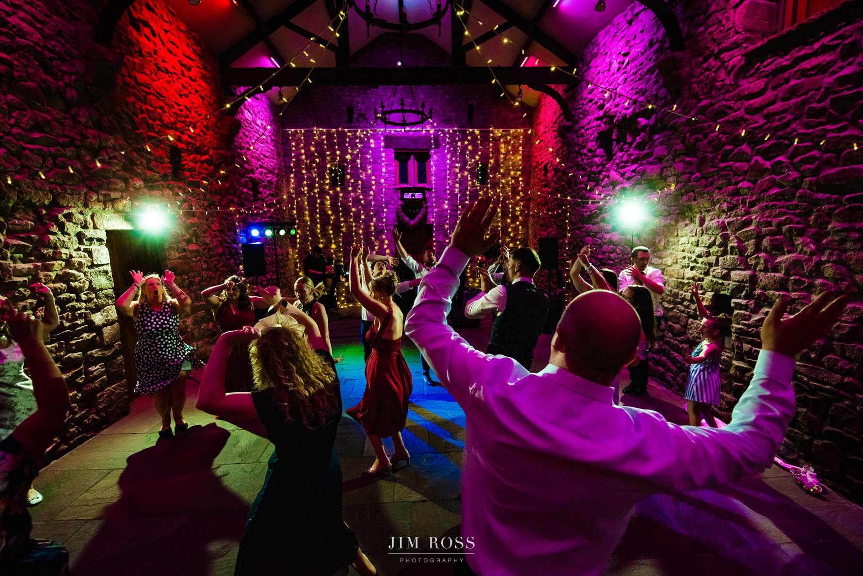 hands in the air at tithe barn wedding