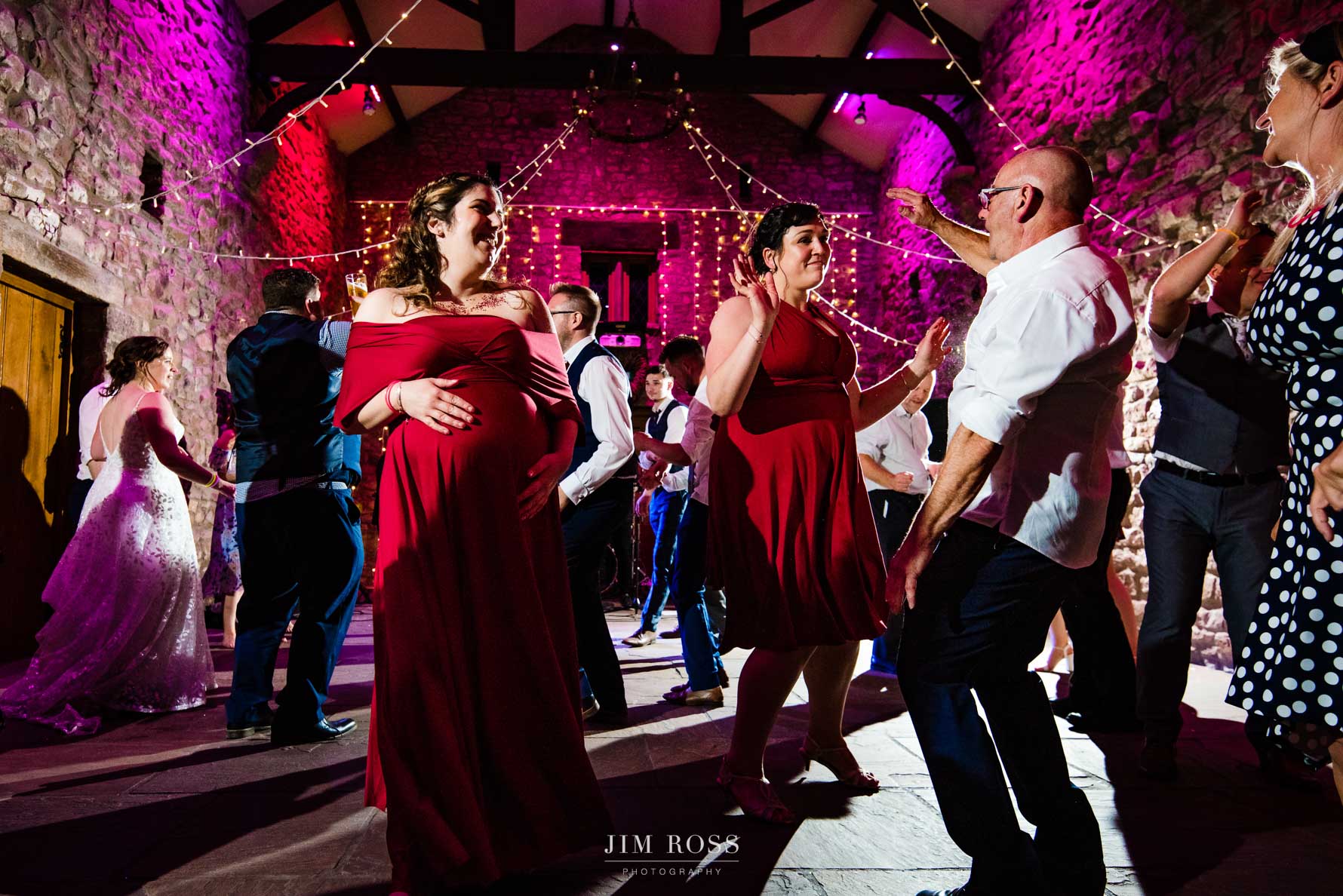 pregnant bridesmaid still dancing late at wedding