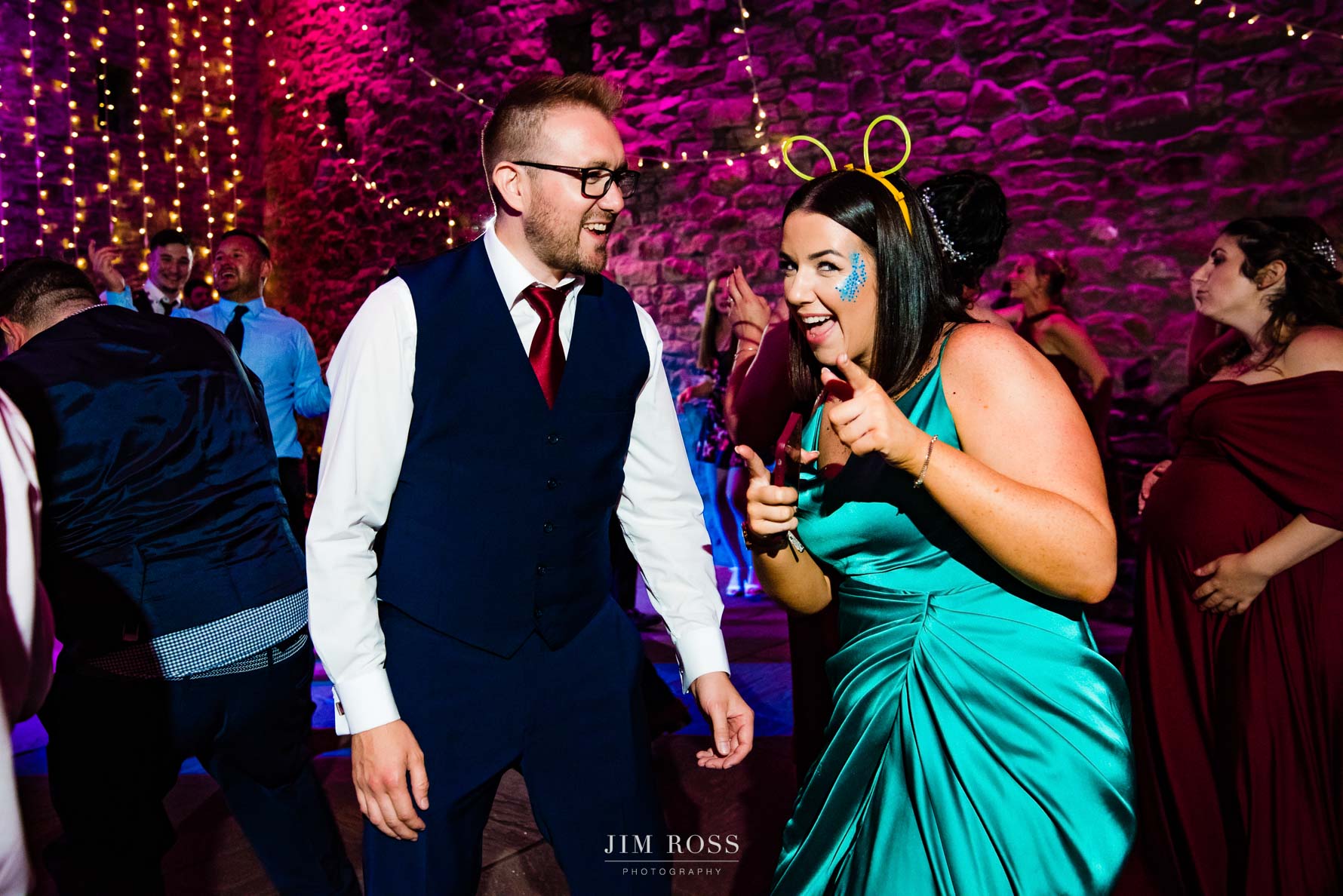 cheeky finger guns from wedding guests