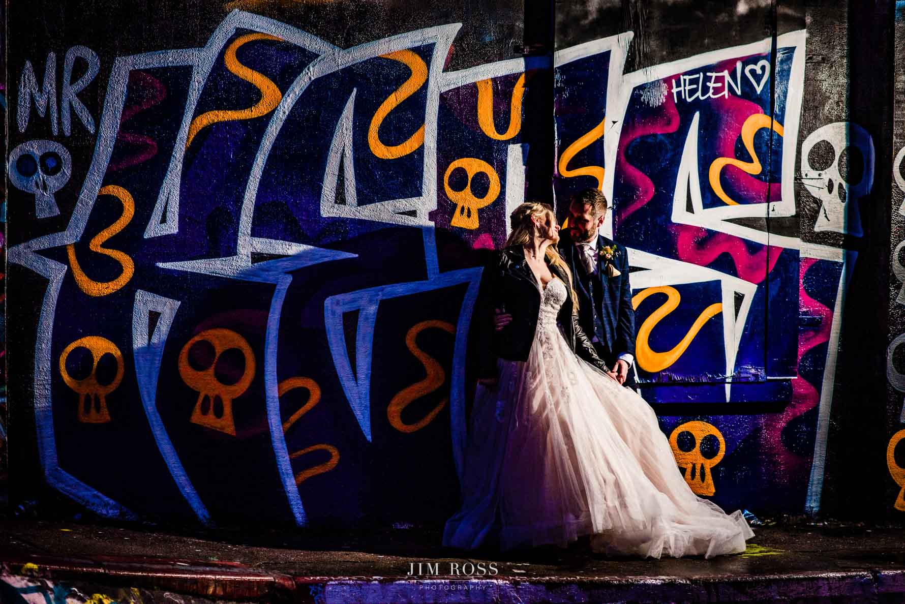 cool skatepark graffiti in wedding night portrait