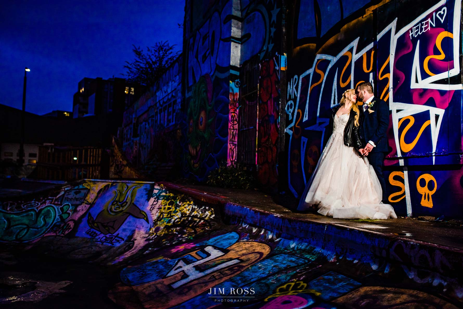 night portrait of newlyweds in skatepark