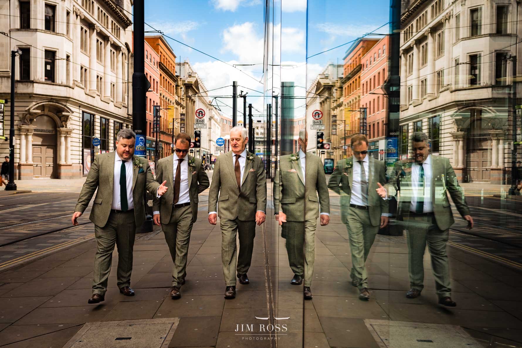 Manchester street reflection of groomsmen